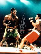 A Joe Frazier signed colour photograph,
16 by 12in., signed in silver marker pen, mounted,