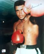A Muhammad Ali signed colour photograph,
10 by 8in. image depicting Ali facing the camera and
