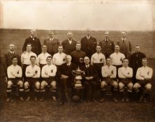 A large sepia-toned original photograph of the Bolton Wanderers 1923 F.A. Cup winning team,
the