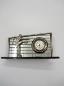 An Italian desk clock set in mirrored back wall with a football figurine to the base circa 1930s