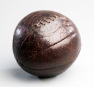 An early leather football dating from the late 19th century,
eight panels, leather lacing
