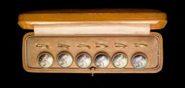 A rare cased set of six Edwardian gentlemen's waistcoat buttons set with coloured prints of lawn