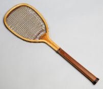 A flat-top tennis racquet circa 1885,
marked E. HICKS, convex wedge and collar to the small round