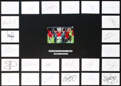 An autographed Manchester United 1999 Treble Winners display,
mounted centrally with a photograph of