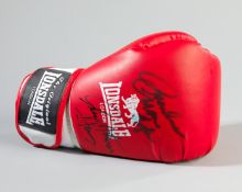 A boxing glove signed by 'Marvellous' Marvin Hagler and Thomas 'The Hitman' Hearns,
A red right-hand