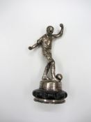 A trophy cup cover surmounted with a figure of a footballer,
15cm., 6in

Provenance: Torino