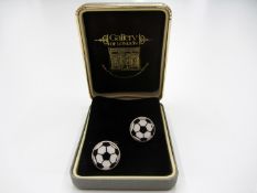 A cased set of football cuff-links by 'Gallery of London'

Provenance: Torino Olympic Stadium Museum