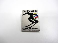 Skiing memorabilia,
Four Skiing World Championship pins, one for Courmayeur in 1984, the others