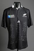 A New Zealand All Blacks rugby shirt signed by the 2011 World Cup winning squad,
30 signatures in