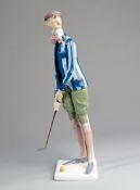 A fine Austrian Amphora golfing figure circa 1935,
the tall male golfer colourfully &