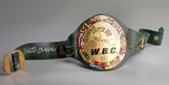 A Roberto Duran signed W.B.C. World Champion replica boxing belt,
signed in silver marker pen to the