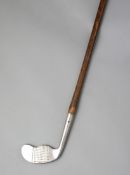 A very curious Forest Brand Suitall putter circa 1935,
for Tooley & Sons, Fetter Lane, London,