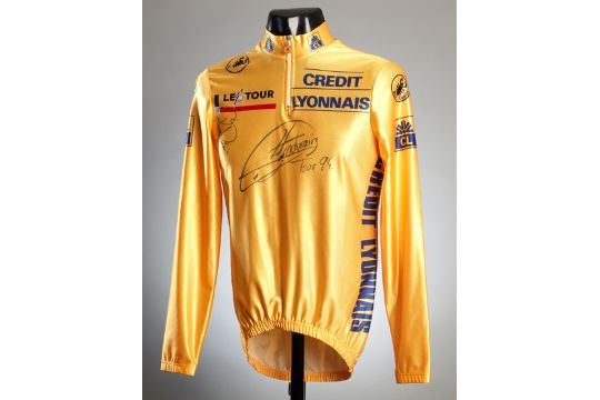 A 1994 Tour de France yellow jersey signed by Miguel Indurain & Rolf  Sorensen, with a COA from T.