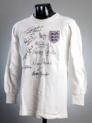 A George Cohen white England No.2 jersey later signed by himself and eight of his team-mates from