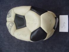 A football signed by the Arsenal double winning team 1970-71,
the black & white panelled ball with