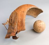 A curved, leather-covered pelota 'basket' probably from the Basque region circa 1900,
together