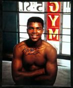 A photograph of a young Ali signed both Cassius Clay and Muhammad Ali,
10 by 8in., signed in fine