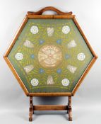 A mahogany fire screen commemorating the F.A. Tour to South Africa in 1910,
the hexagonal frame