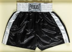 A pair of trunks signed by the boxing champions Muhammad Ali, George Foreman, Joe Frazier, Ken