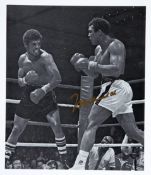 A Muhammad Ali v Leon Spinks picture autographed by Ali,
signed in gold marker pen, 7 1/4 by 6in.