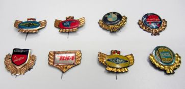Eight 1940s-50s motor car and motorcycle small metal pin badges,
comprising manufacturers motifs for