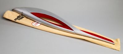 A Sochi 2014 Winter Olympic Games bearer's torch,
in original carrying case, numbered "134", also