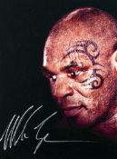 A Mike Tyson signed photographic print on canvas,
signature in silver marker pen, the image 38 by