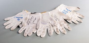 A group of five golf gloves signed by Masters winners,
comprising: Seve Ballesteros, Nick Faldo,