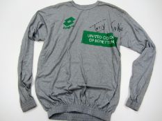 A Toni Kukoc signed Benetton Treviso basketball training top,
signed in black marker pen