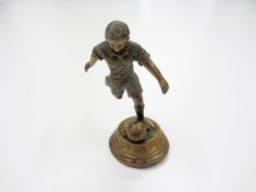 A brass football figurine,
12.5cm., 5in

Provenance: Torino Olympic Stadium Museum of Sport