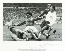 Two signed b&w photographic prints,
the first a 12 by 20in. image of Geoff Hurst scoring his hat-