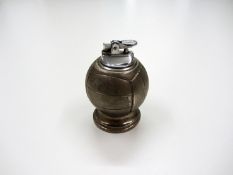 A table cigarette lighter with football design
11cm., 4 1/4in.

Provenance: Torino Olympic Stadium