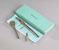 A silver pen by Tiffany of New York with the pocket clip designed as a tennis racquet,
stamped .