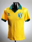 A replica mid-1980s Brazil football shirt signed by Pele,
signed at the World Travel Market in