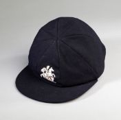 A MCC touring cap awarded to Colin Milburn in the 1960s,
navy blue with St George & Dragon motif,