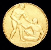 A Paris 1924 Olympic Games gold first place winner's medal,
goldplated silver, designed by Andre