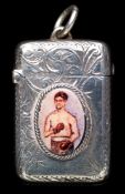 A silver vesta set with an oval enamel portrait of a boxer,
hallmarked Chester, 1915, owner's