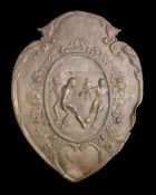 A spelter plaque originally fitted to a football trophy shield circa 1930s,
with a football scene,