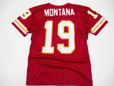 A Joe Montana signed red American Football No.19 jersey,
Signed to the reverse number lettered