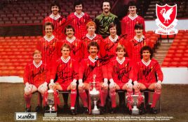 A team-signed Liverpool FC poster dated 1983,
the colour poster fully-signed in black marker pen
