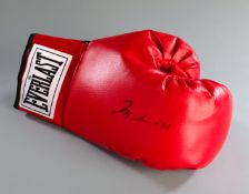 An Alico (Steve Jackson) certified Muhammad Ali signed boxing glove,
the COA with a photograph