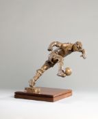 A Frederick Kail metalware figure of a footballer,
signed by the American sculptor in gold pen to