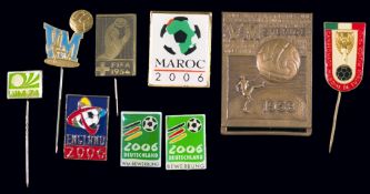 Nine World Cup pin badges,
comprising 1954, two for 1958, 1970, 1974 and four for 2006