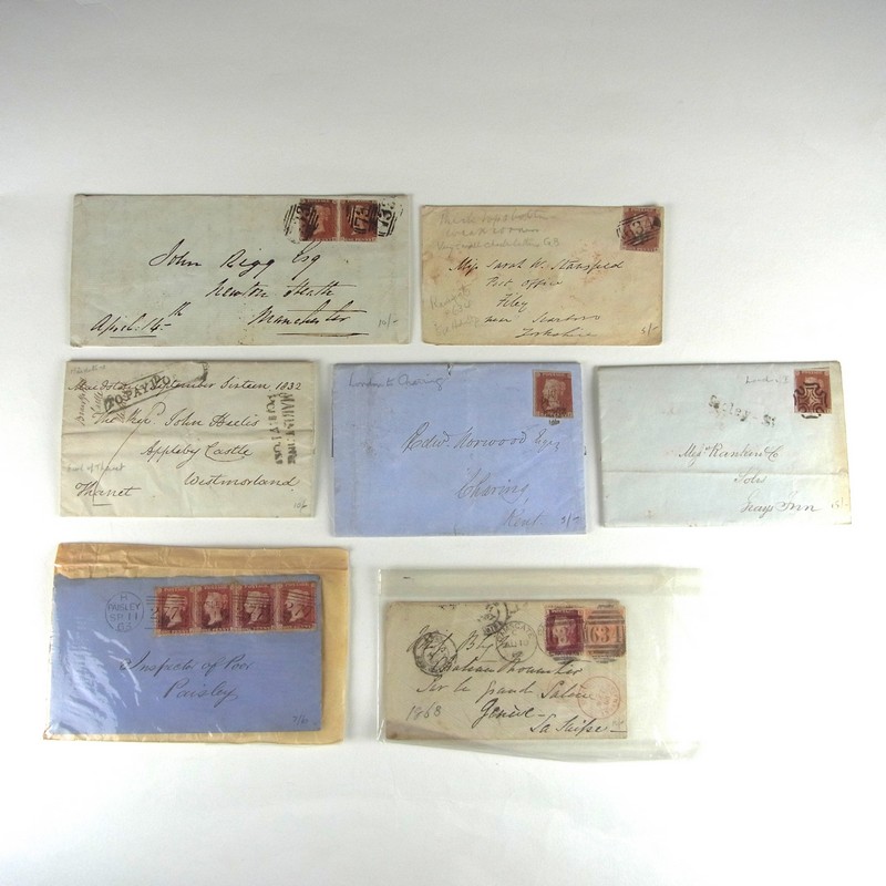 A collection of Victorian Penny Red envelopes and letters. Comprising of an envelope with a group of