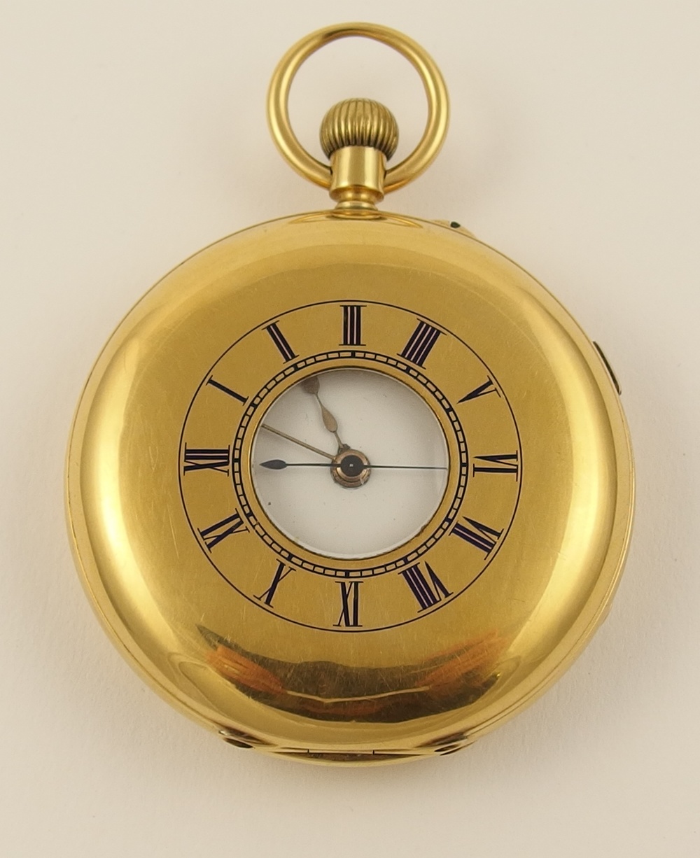 An 18ct gold half hunter pocket watch with outer case numerals picked out in blue enamel, inner