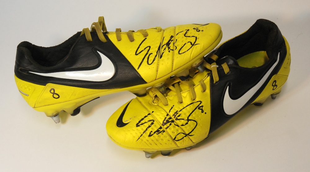 A pair of Nike CTR360 match worn football boots each boot autographed by Celtic captain Scott Brown