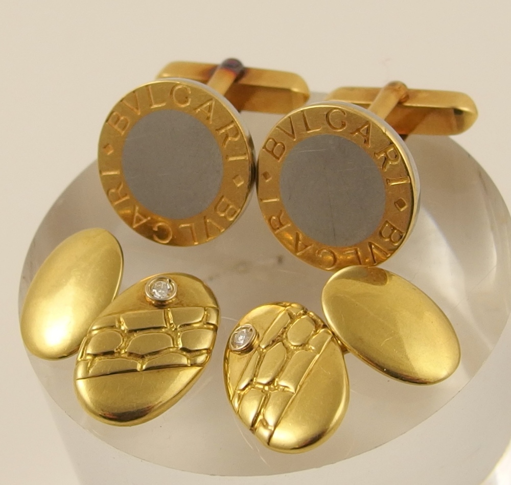 Two pairs of Bulgari style cufflinks the first of circular form bi-colour 18ct gold with BVLGARI