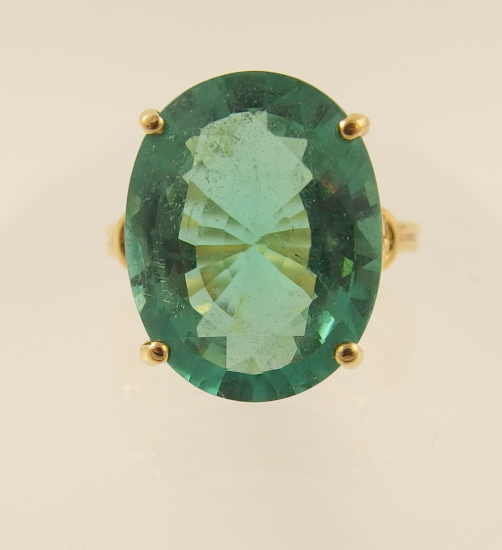 A substantial tourmaline ring the oval brilliant cut tourmaline is approximately 12.71cts 18mm x