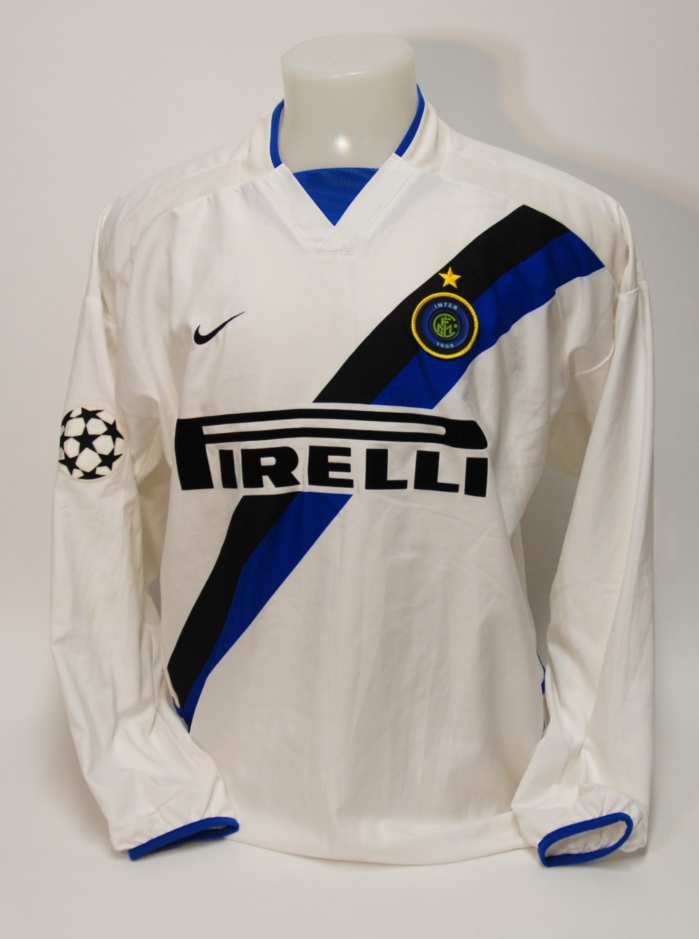 A white Inter Milan shirt No.9, with v-neck collar and embroidered cloth badge, inscribed Inter