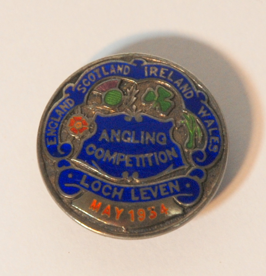 A silver and enamel angling lapel badge the obverse inscribed England Scotland Ireland Wales,